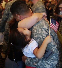 july 29 soldier hugging family 2 True Sacrifice   4th of July